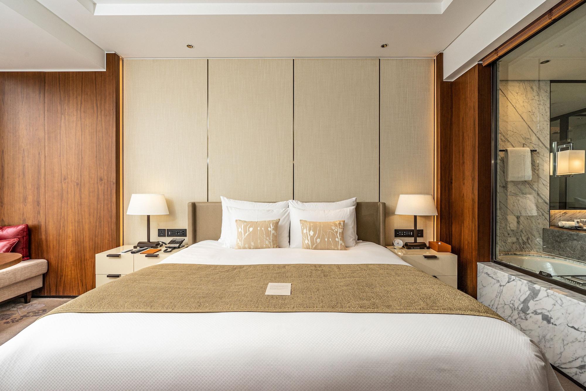 فندق لوتي، سيول إكزكيوتف تاور المظهر الخارجي الصورة A bedroom at the hotel